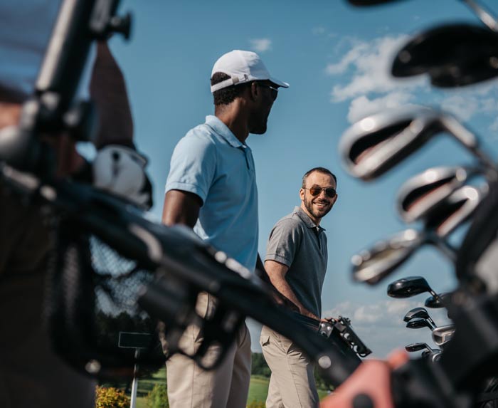 A group of golfers talking