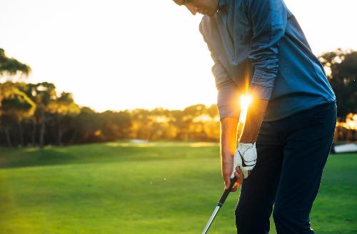 A golfer hitting a ball