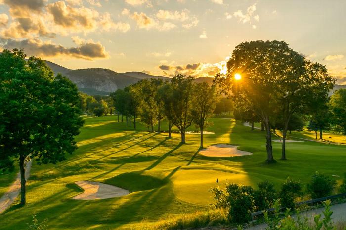 A golf course at sunset